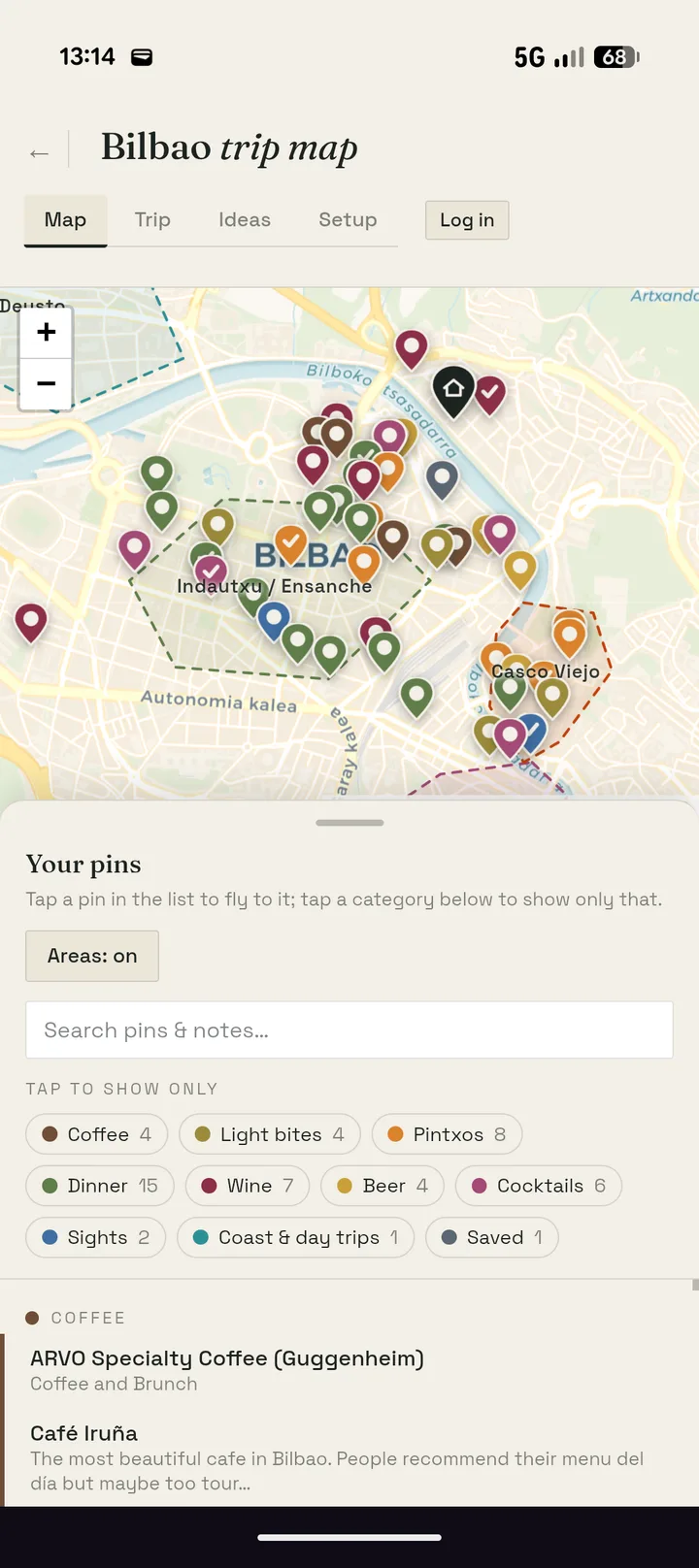 The Bilbao trip map on a phone — categorised pins over a paper-toned map